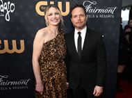 Scott Wolf and wife Kelley Wolf pose on the red carpet of The 28th Annual Critics Choice Awards - Image via Getty.